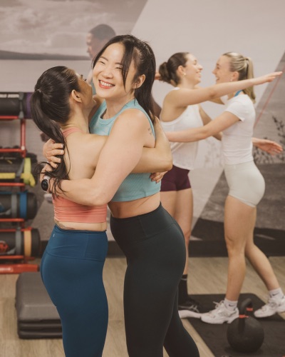 Clients celebrating together after a group training session